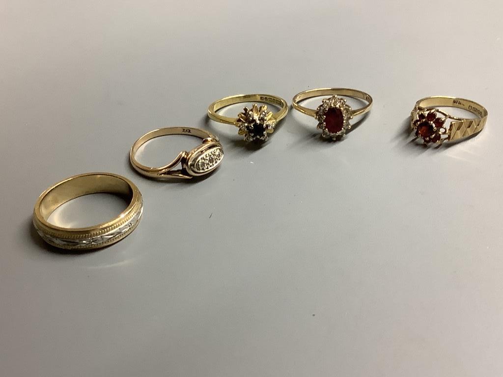 An 18ct gold, sapphire and diamond ring, gross 3.2 grams and four 9ct gold rings, two gem-set, gross 10 grams.